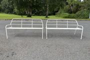 A matching pair of vintage tubalar steel garden benchs c1950