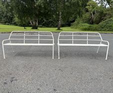 A matching pair of vintage tubalar steel garden benchs c1950