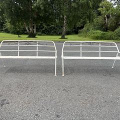 A matching pair of vintage tubalar steel garden benchs c1950