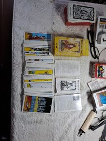 3 complete tarot cards sets.
