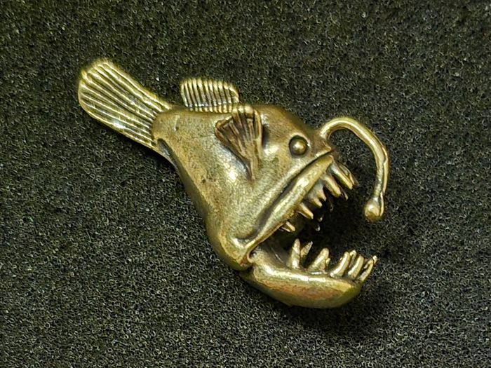 3 brass fish.
