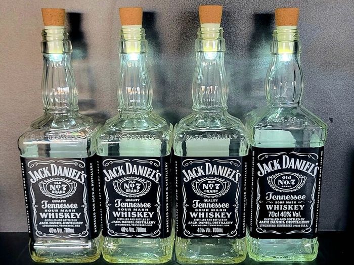 10 empty Jack Daniel bottles