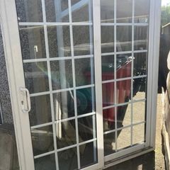 White uPVC sliding patio doors with Georgian bars