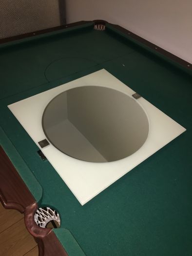 Tilting bathroom mirror
