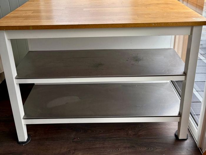 IKEA Free-standing kitchen island with foldable chairs.