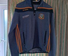 O'Neills Meath GAA Zip Top. Age 13. Width 47cm, Length 54cm. Very Good Condition. Price Includes Postage.