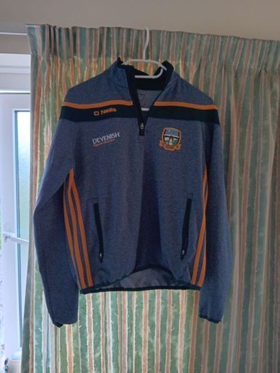 O'Neills Meath GAA Zip Top. Age 13. Width 47cm, Length 54cm. Very Good Condition. Price Includes Postage.