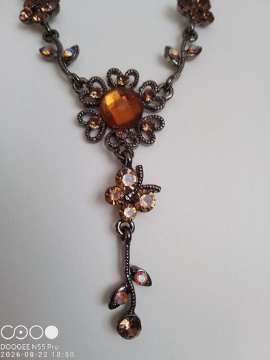 Victorian revival aesthetic  dark antiqued metal with warm amber tones
