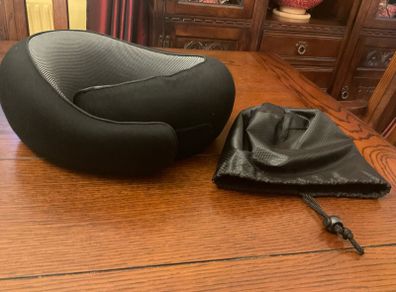 Travel  neck support pillow Reduced in black with a storage bag