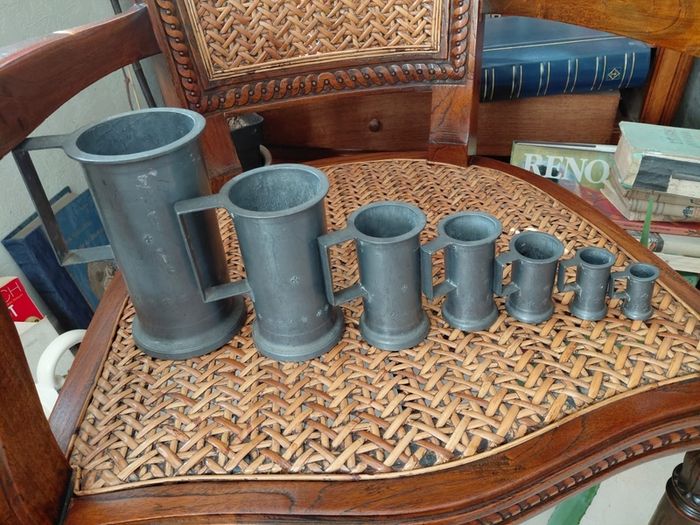 Antique French solid pewter measuring tankards Fleurs de lys complete set