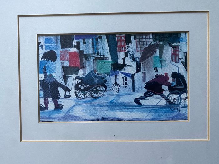 a pair of prints framed and glazed in a white frame