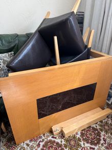 Wooden table and leather chairs