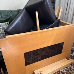 Wooden table and leather chairs