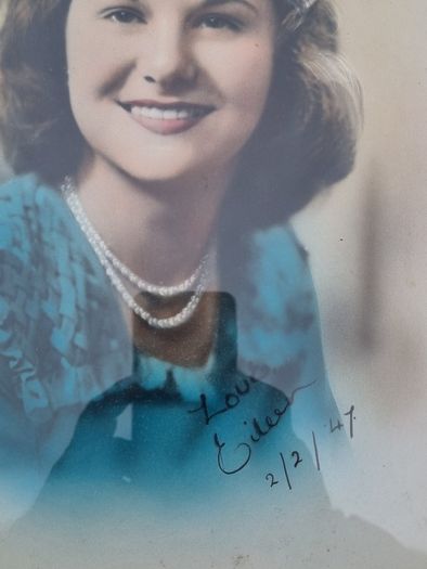 Archival, hand-colored portrait of a woman