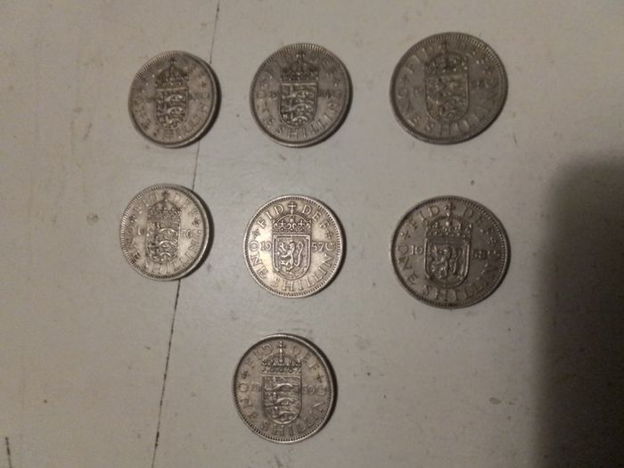 7.UK One Shilling Coins.