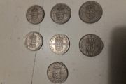 7.UK One Shilling Coins.