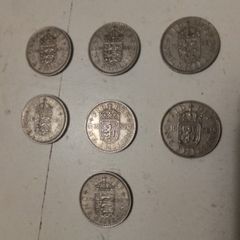 7.UK One Shilling Coins.