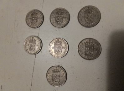 7.UK One Shilling Coins.