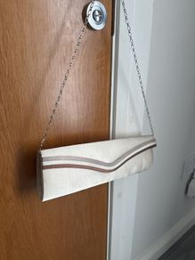 Satin clutch with detachable strap chain