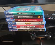 PS4 Pro Console + 2 Controllers & 7 Games