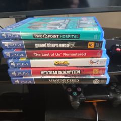 PS4 Pro Console + 2 Controllers & 7 Games