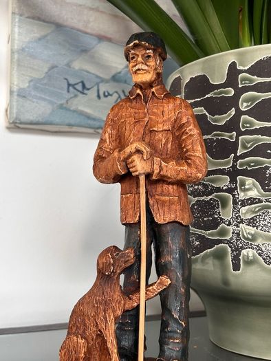 Beautiful man and dog wooden carved figure