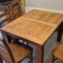 Extendable oak table with 5 matching chairs Image 3