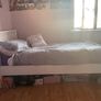 Solid white single bed frame. Image 2
