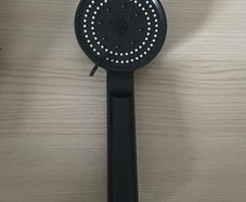 Modern matte black handheld shower head with multi-spray settings