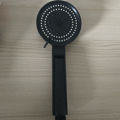 Modern matte black handheld shower head with multi-spray settings