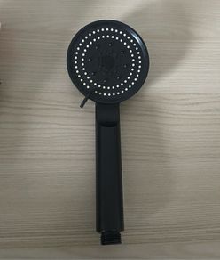 Modern matte black handheld shower head with multi-spray settings