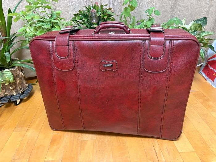 Vintage burgundy faux-leather suitcase