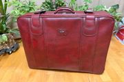Vintage burgundy faux-leather suitcase