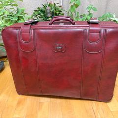 Vintage burgundy faux-leather suitcase