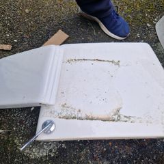 Used ceramic toilet cistern tank