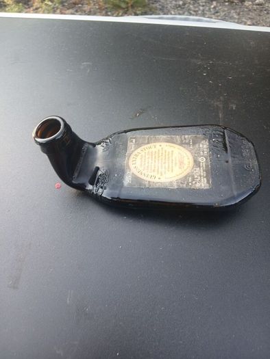 melted guiness bottles