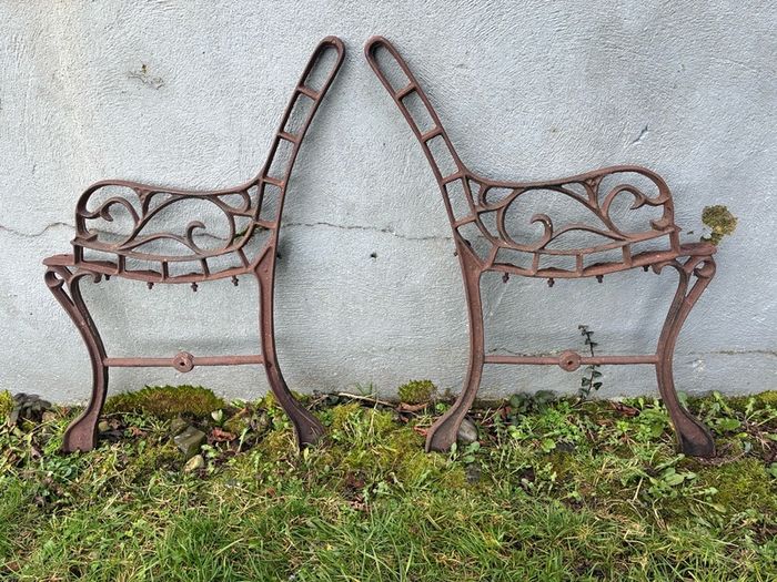 Pair cast iron children's bench ends