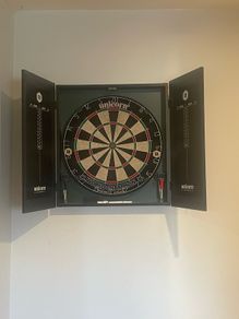 dart board with darts