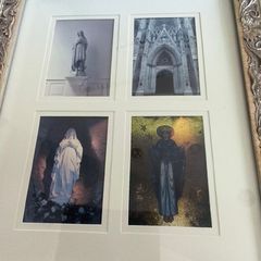 Large, ornate silver gold-toned, carved wooden frame containing a white multi-window mat holding four distinct religious and architectural art prints, including a statue of the Virgin Mary, a Gothic cathedral entrance, and devotional figures