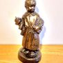Boy Statue in a Home Dress with Bear Toy & Books. Image 5