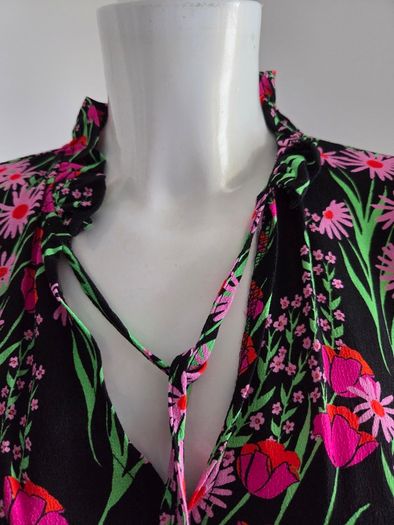 New. Warehouse Size 8 Black Floral print dress with frill trim.