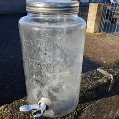 Large glass jar with tap.