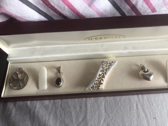 4 silver pendents