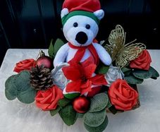 Christmas basket with teddy bear and artificial flowers