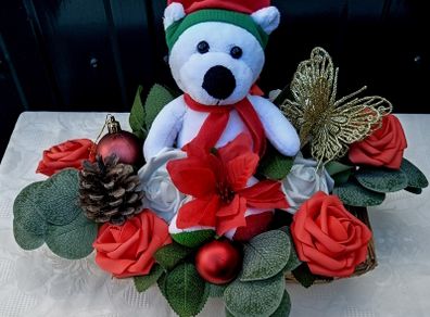 Christmas basket with teddy bear and artificial flowers
