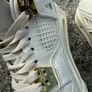 Air Jordan 4 White and Gold Trainers Image 8