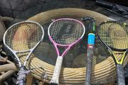 3 kids tennis rackets and camogie stick