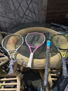 3 kids tennis rackets and camogie stick