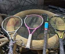 3 kids tennis rackets and camogie stick