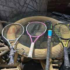 3 kids tennis rackets and camogie stick